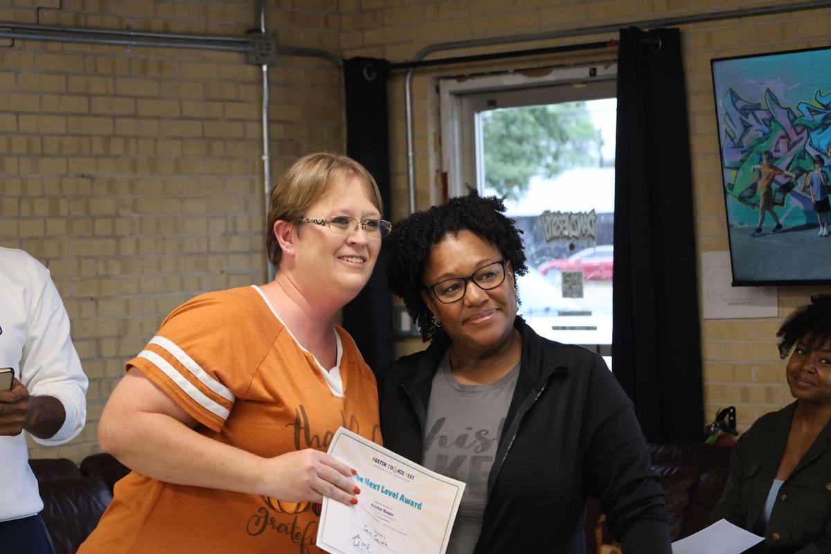 Samantha Smith receiving The Next Level Award from Chef Heather Biagas